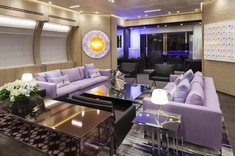 a living room with a couch and a coffee table aboard CRAZY ME Yacht for Sale