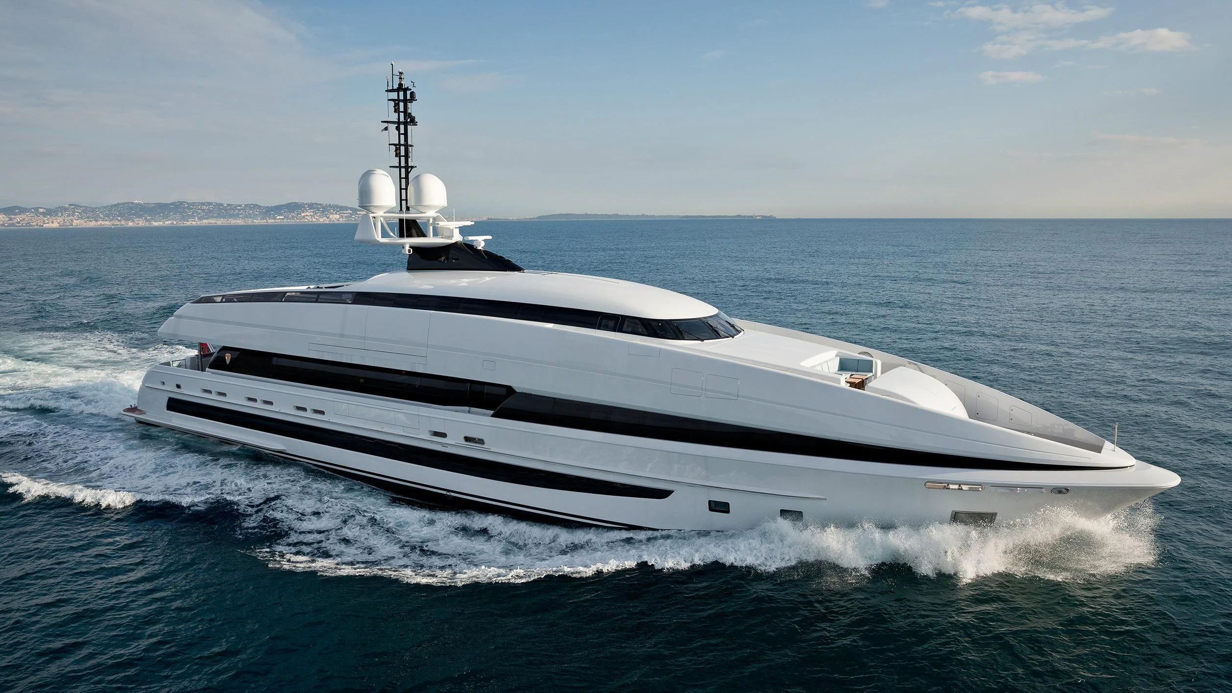 a white yacht in the water aboard CRAZY ME Yacht for Sale