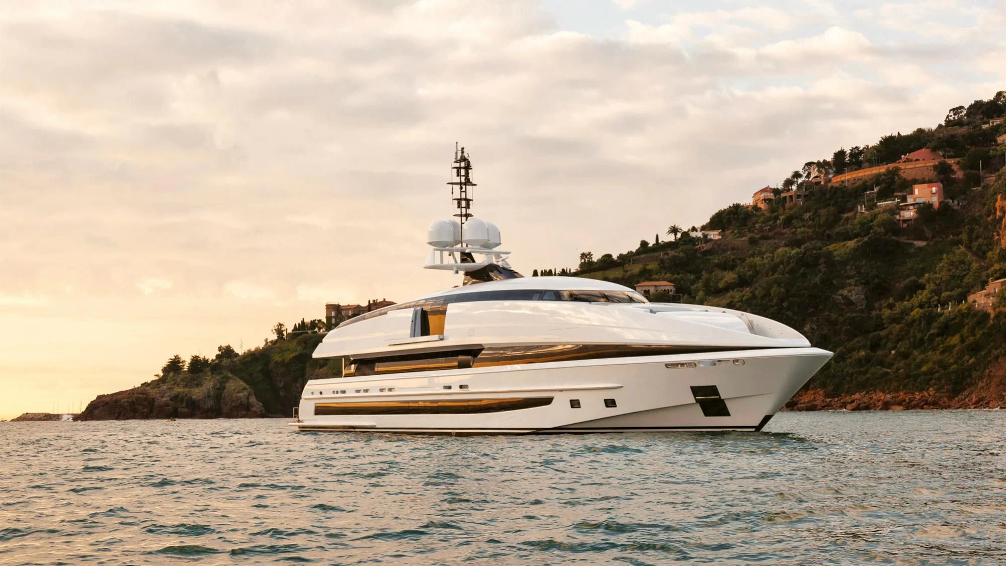 a white yacht in the water aboard CRAZY ME Yacht for Sale