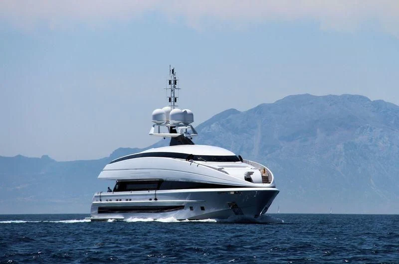 a white yacht in the water aboard CRAZY ME Yacht for Sale