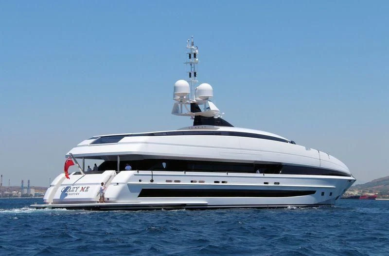 a white yacht in the water aboard CRAZY ME Yacht for Sale