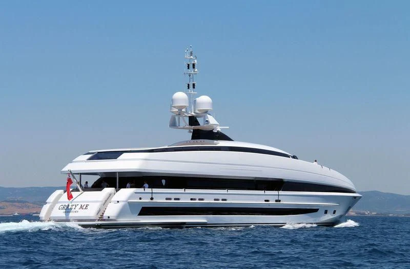 a white yacht in the water aboard CRAZY ME Yacht for Sale