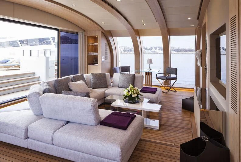 a living room with a large window aboard CRAZY ME Yacht for Sale