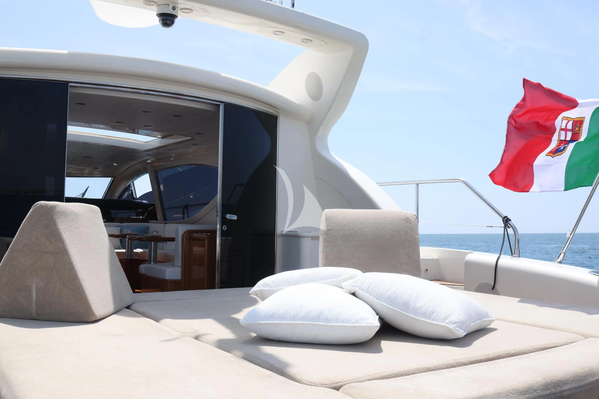 a bed with pillows on it aboard BRAVO DELTA Yacht for Sale