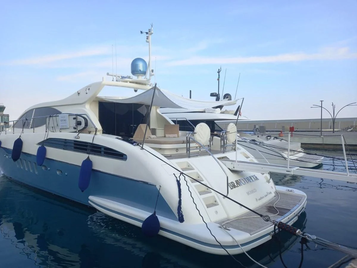 a boat docked at a pier aboard BRAVO DELTA Yacht for Sale