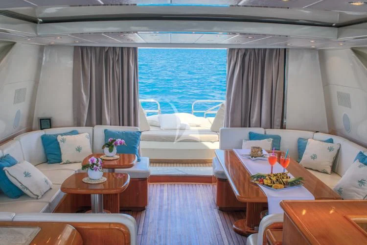 a room with a bed and a table aboard BRAVO DELTA Yacht for Sale