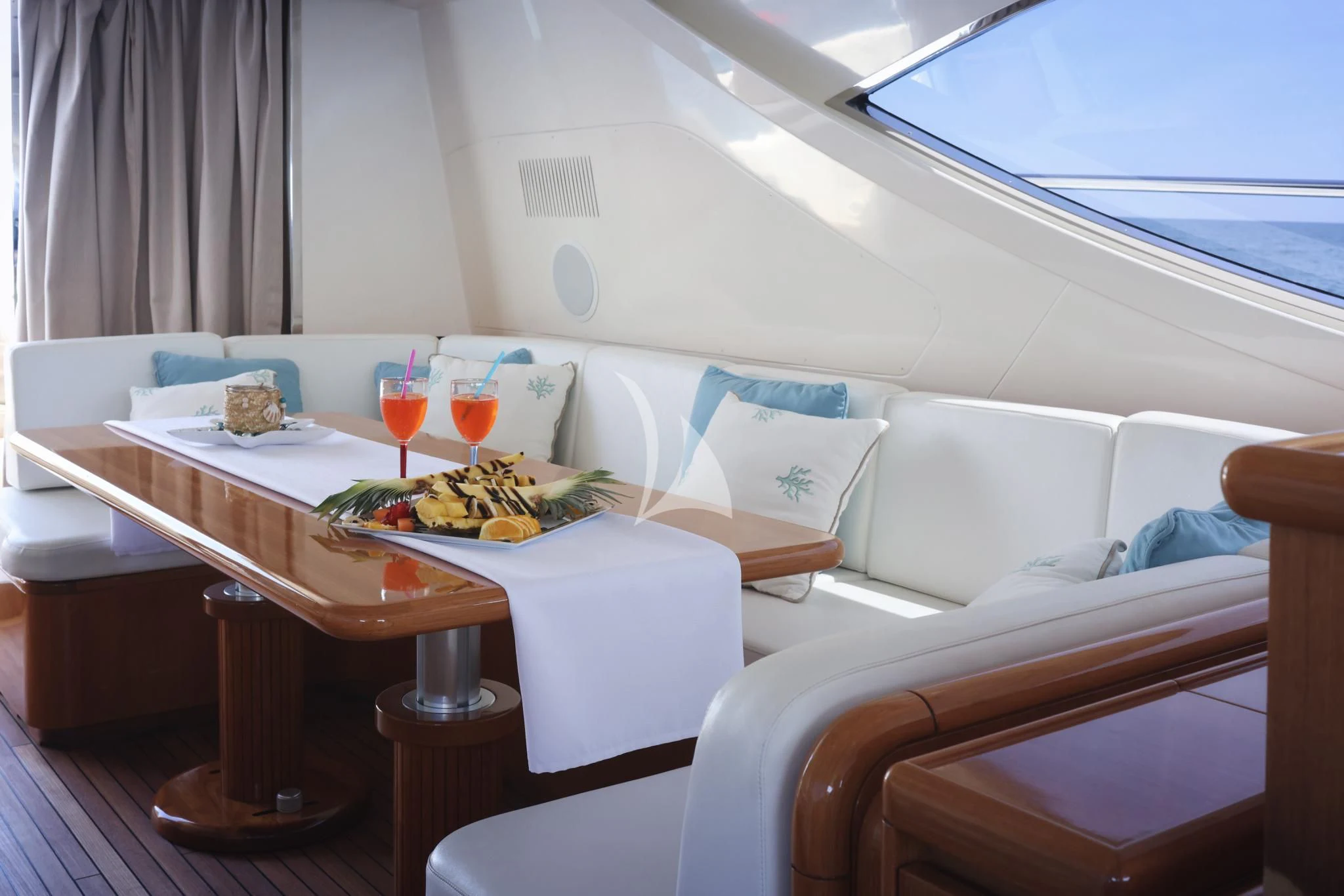 a room with a table and chairs aboard BRAVO DELTA Yacht for Sale
