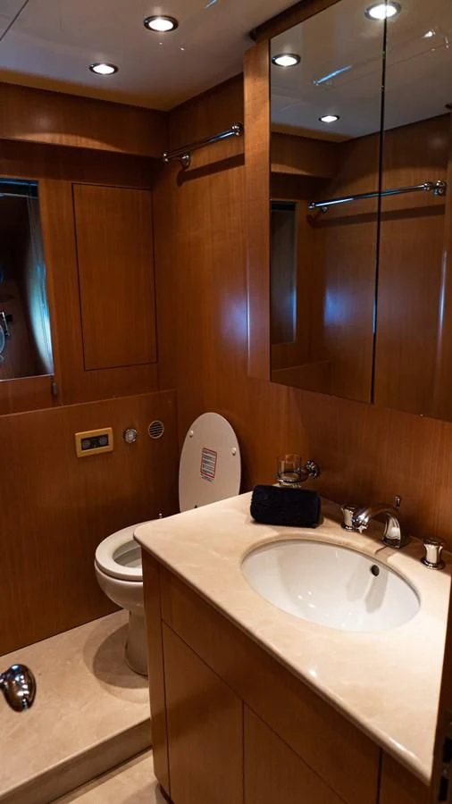 a bathroom with a sink and a toilet aboard BRAVO DELTA Yacht for Sale