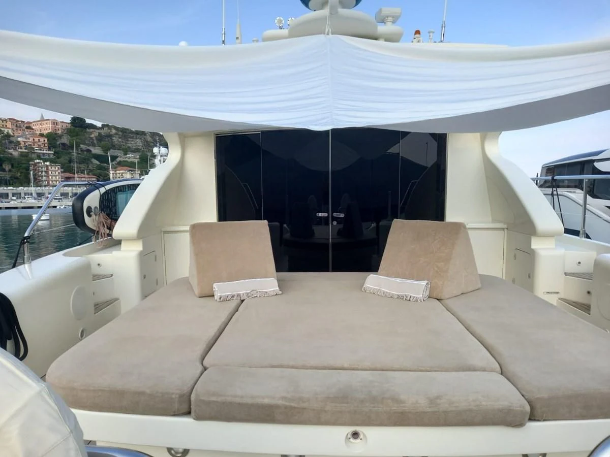 a couch with a canopy over it aboard BRAVO DELTA Yacht for Sale