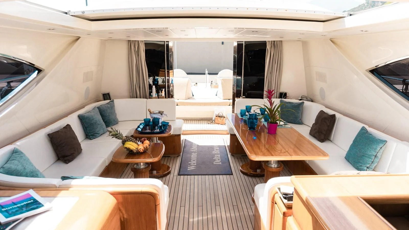 a room with a couch and a table aboard BRAVO DELTA Yacht for Sale