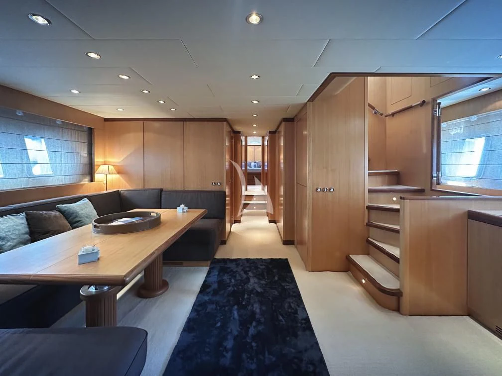 a room with a couch and a table aboard BRAVO DELTA Yacht for Sale