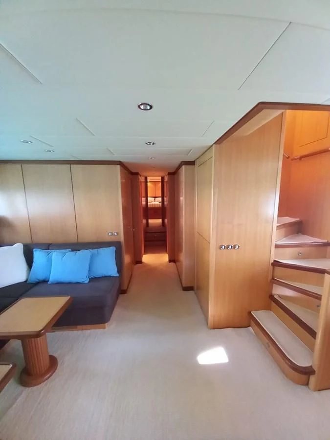 a room with a bed and a desk aboard BRAVO DELTA Yacht for Sale