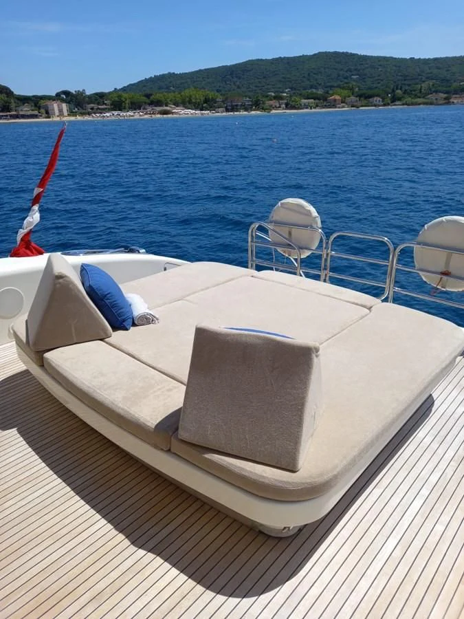 a boat with chairs on the deck aboard BRAVO DELTA Yacht for Sale