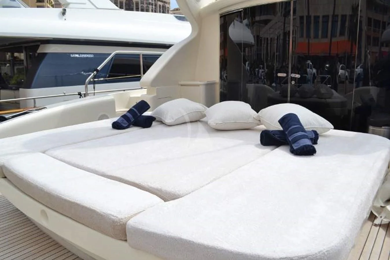 a bed with white sheets and pillows aboard BRAVO DELTA Yacht for Sale