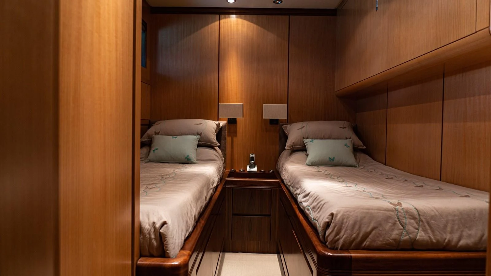a couple of beds in a hotel room aboard BRAVO DELTA Yacht for Sale