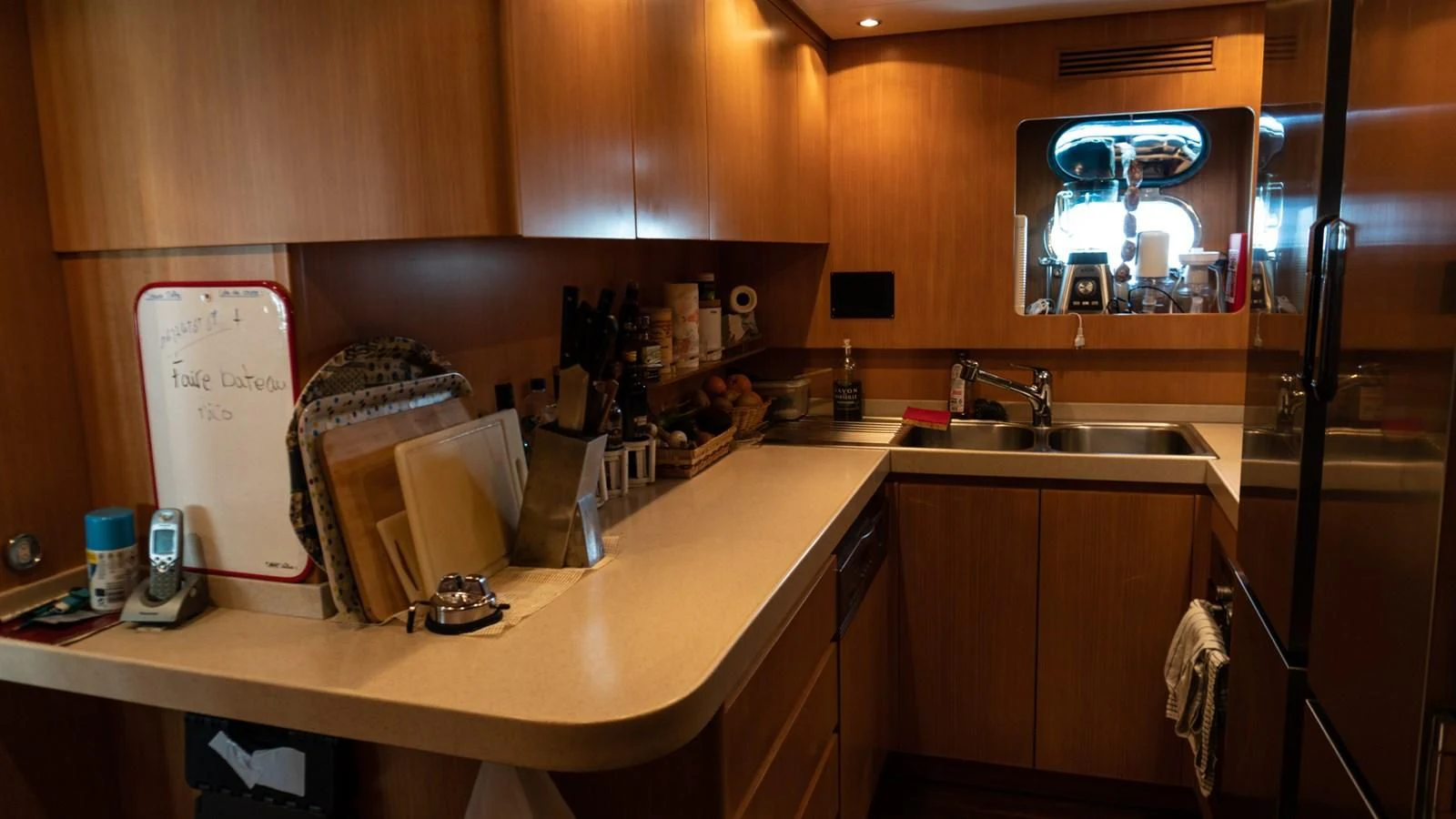a kitchen with a microwave oven and a sink aboard BRAVO DELTA Yacht for Sale