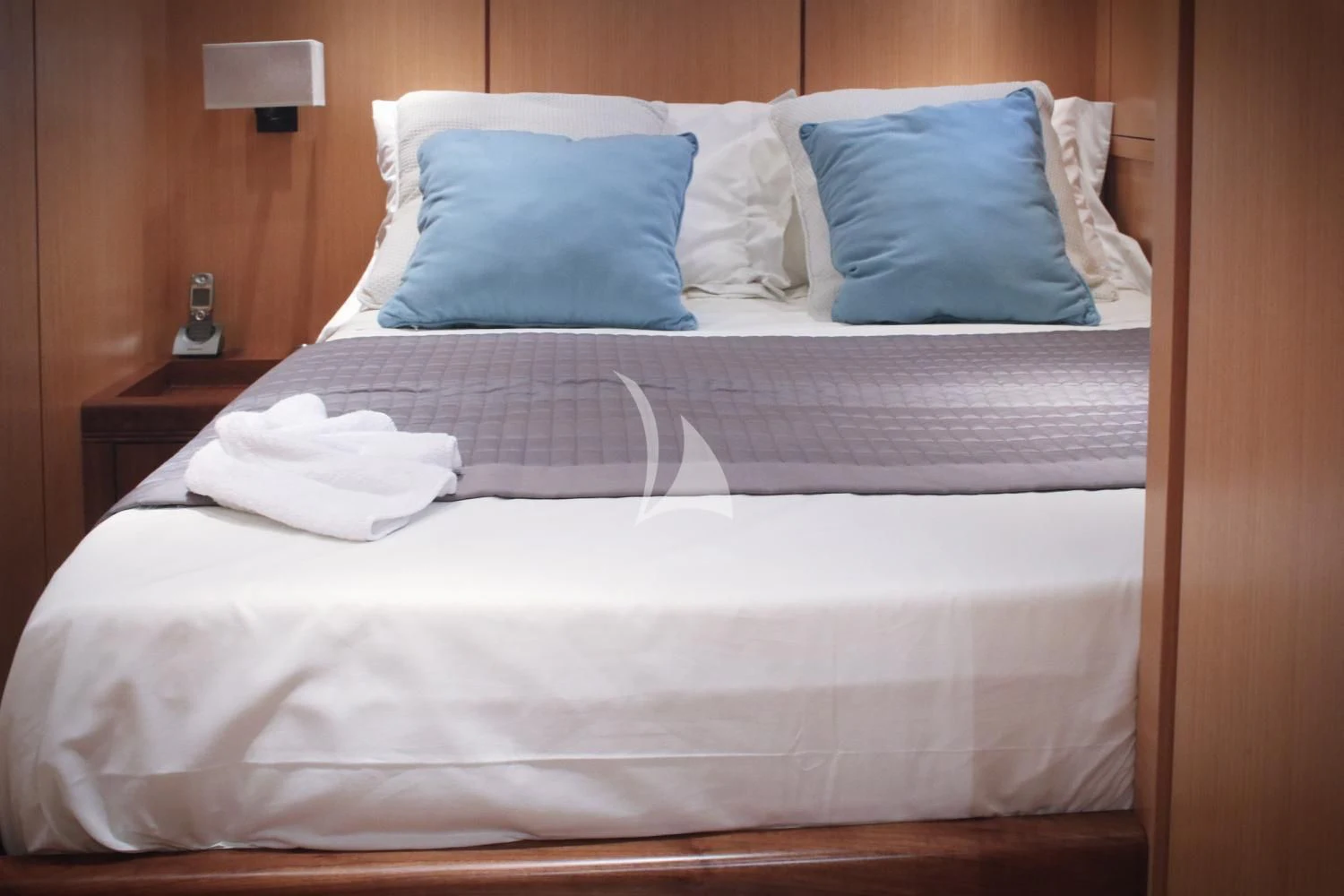 a bed with white sheets aboard BRAVO DELTA Yacht for Sale