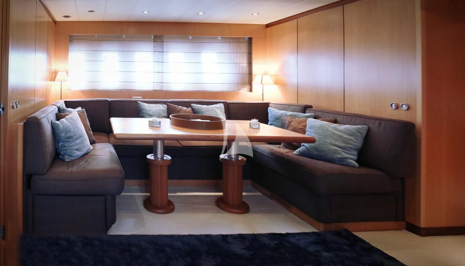a living room with a couch and a coffee table aboard BRAVO DELTA Yacht for Sale
