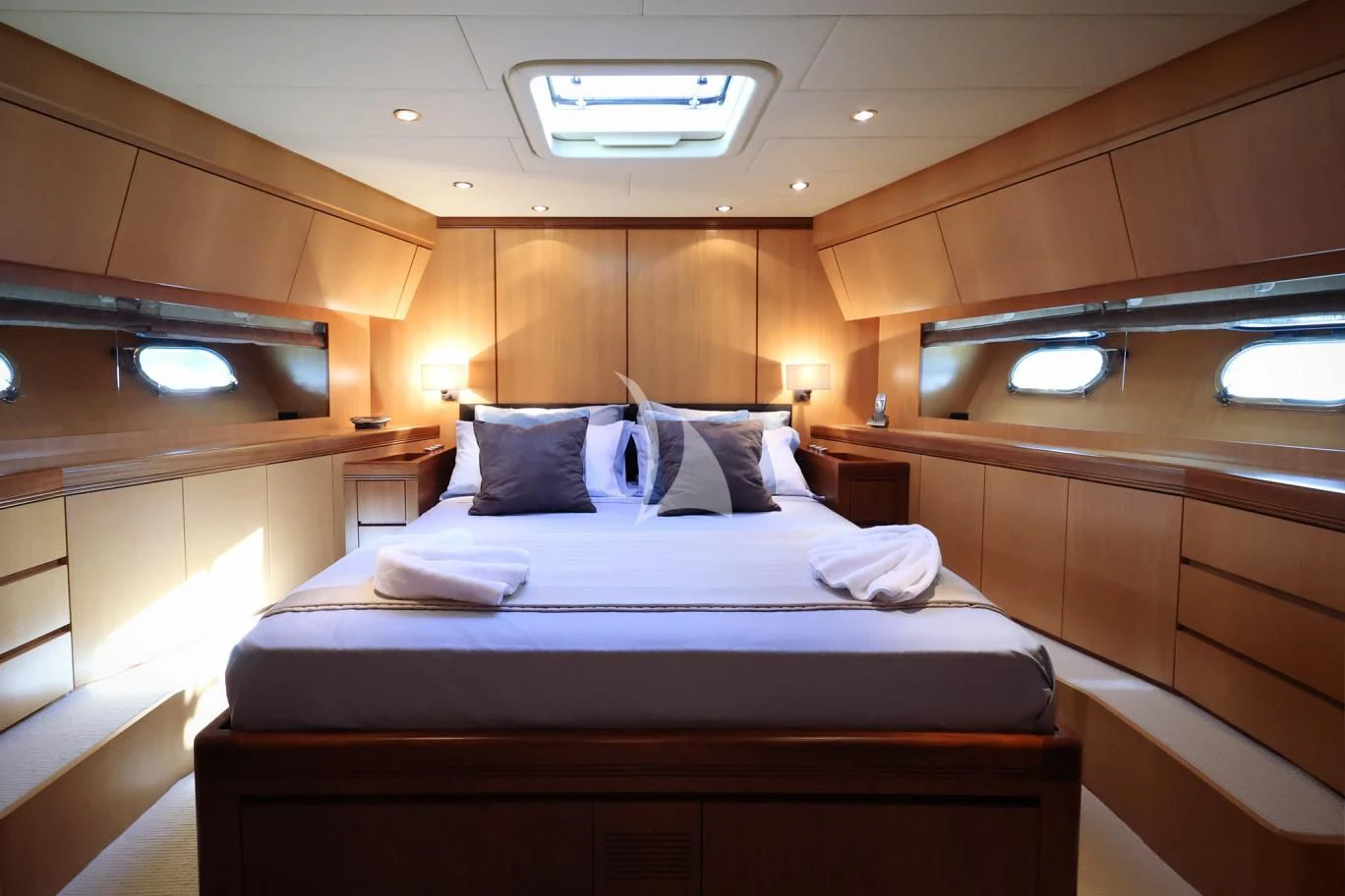 a room with a bed and a desk aboard BRAVO DELTA Yacht for Sale