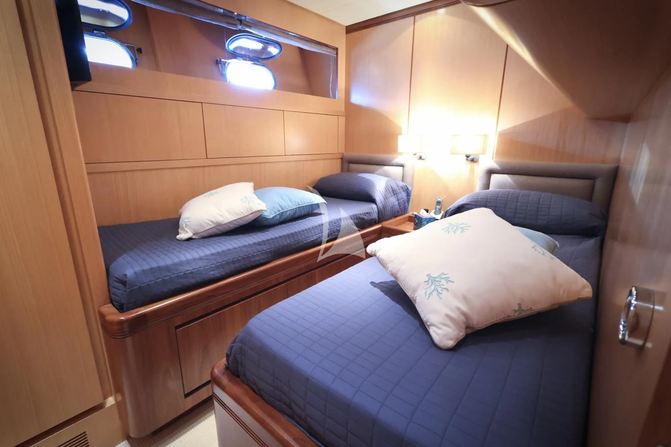a couple of beds in a room aboard BRAVO DELTA Yacht for Sale