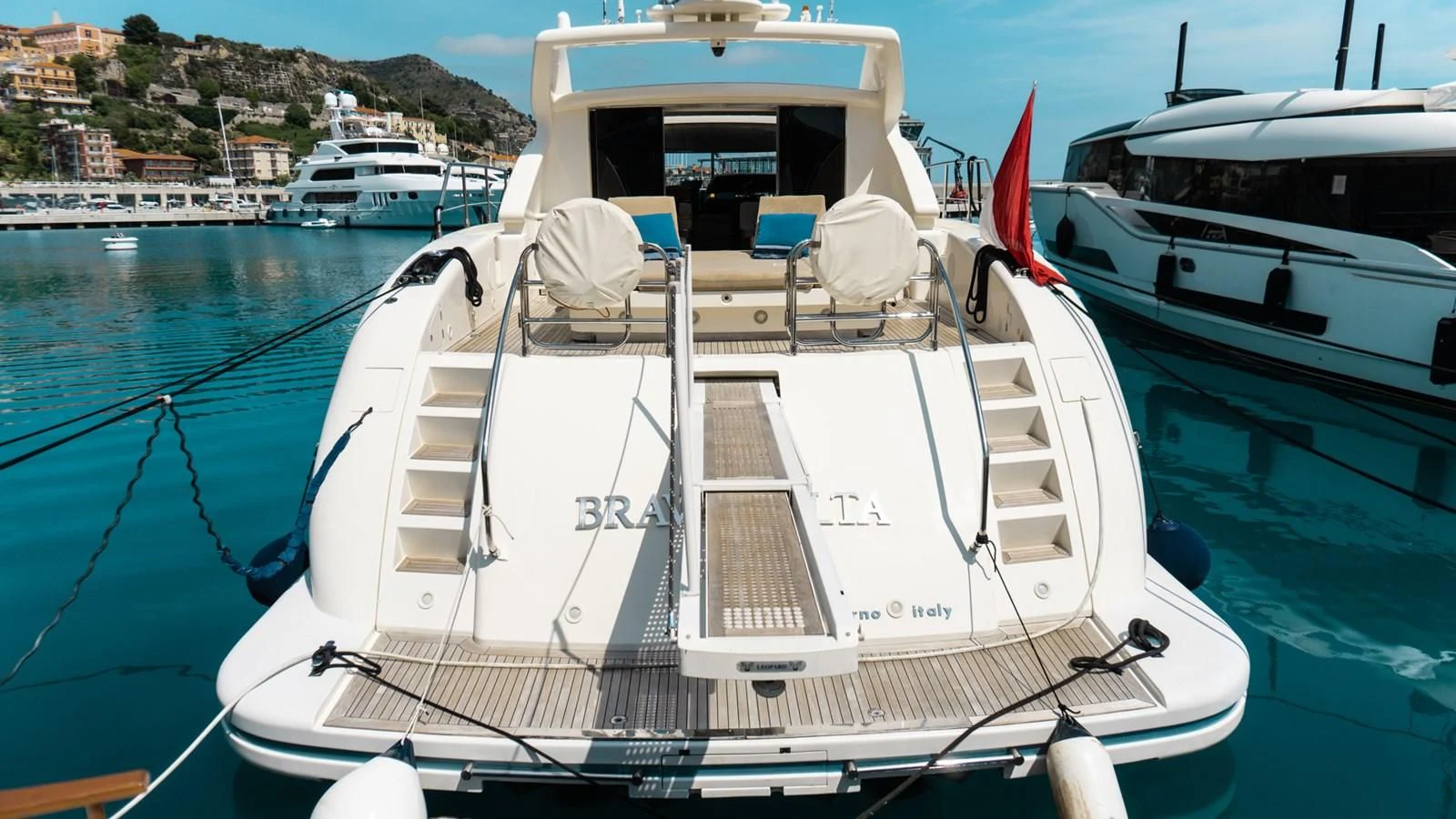 a white boat on a body of water aboard BRAVO DELTA Yacht for Sale