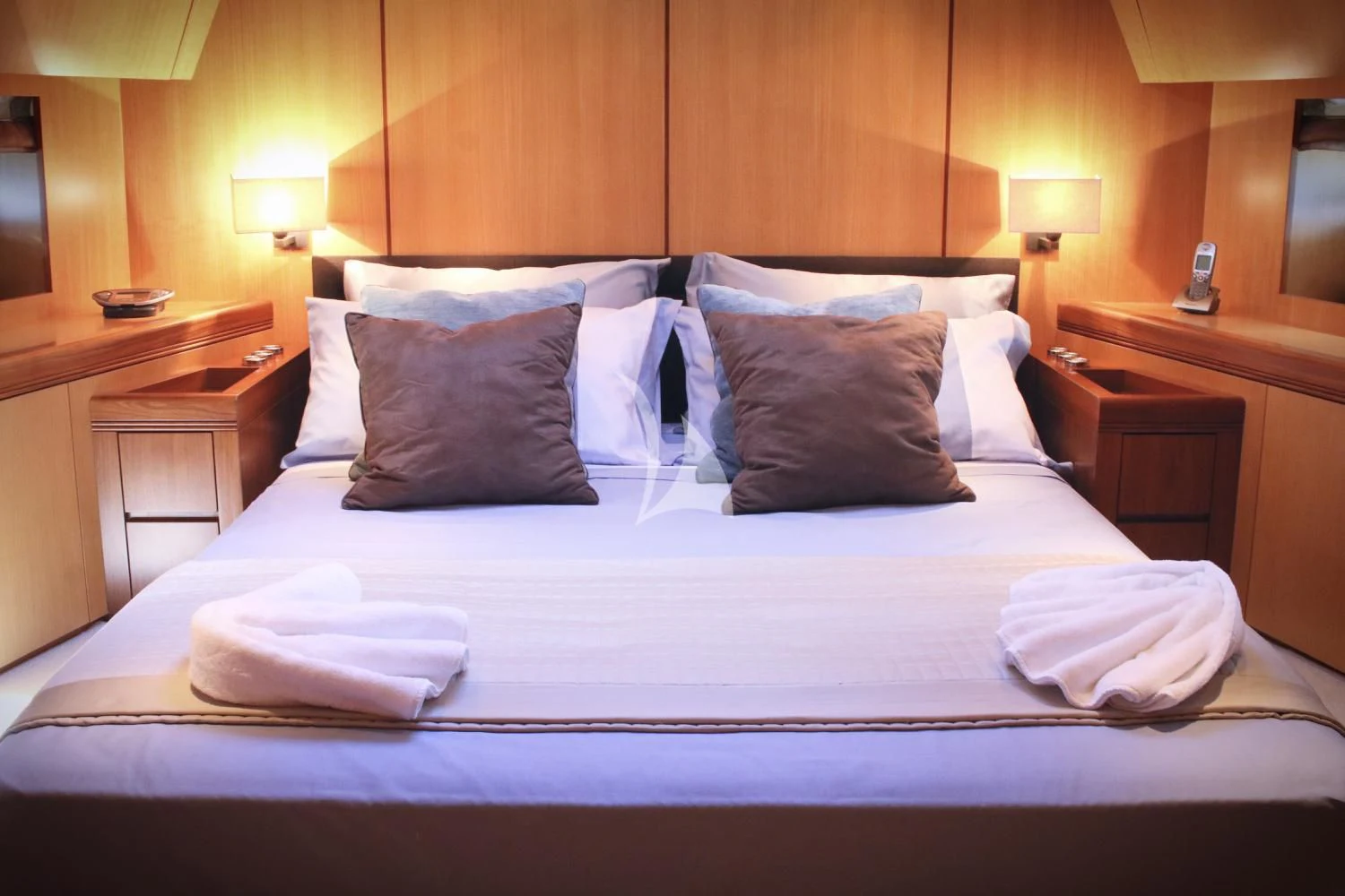 a bed with pillows aboard BRAVO DELTA Yacht for Sale