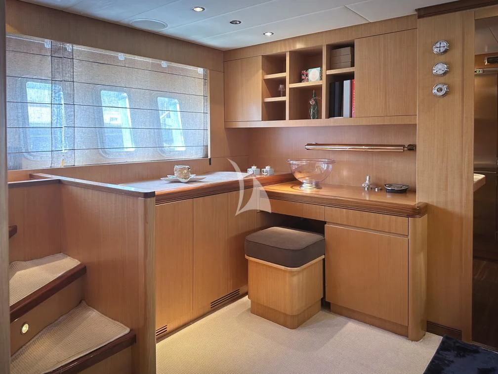 a kitchen with wooden cabinets aboard BRAVO DELTA Yacht for Sale