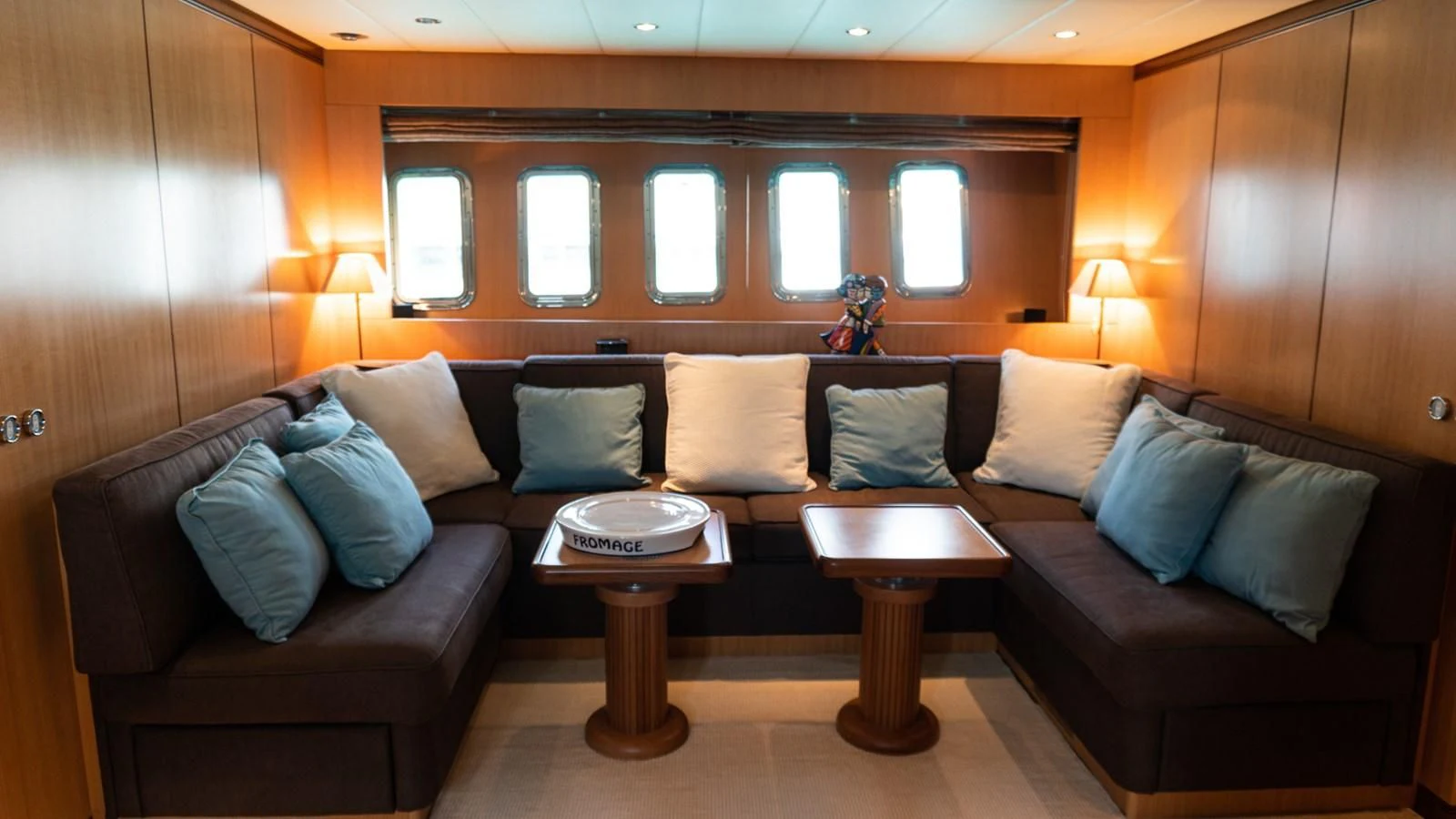 a living room with a couch and a coffee table aboard BRAVO DELTA Yacht for Sale
