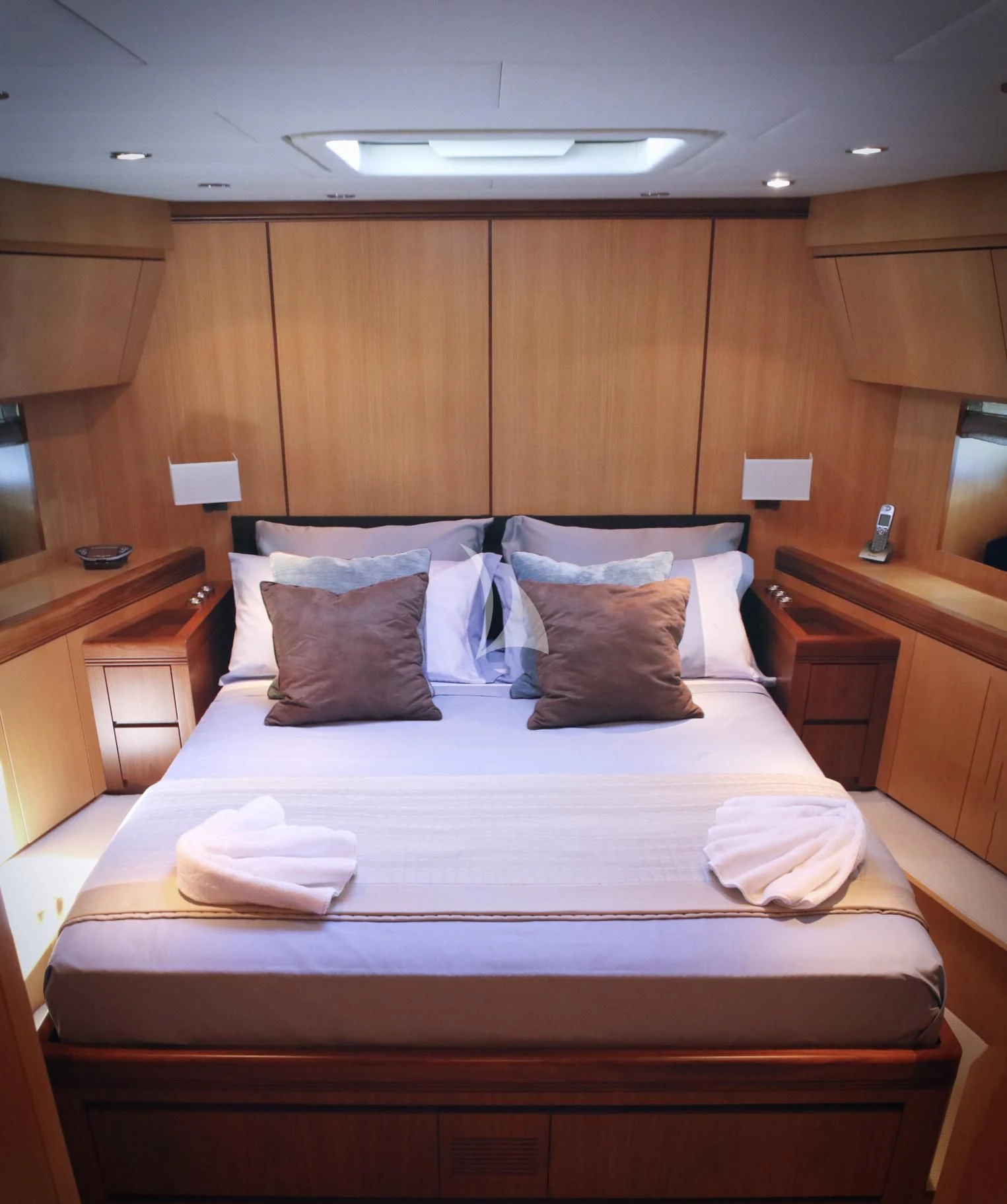 a bed with pillows aboard BRAVO DELTA Yacht for Sale