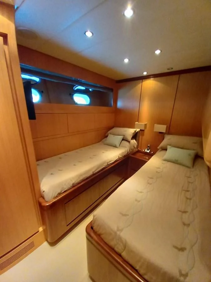 a room with two beds aboard BRAVO DELTA Yacht for Sale