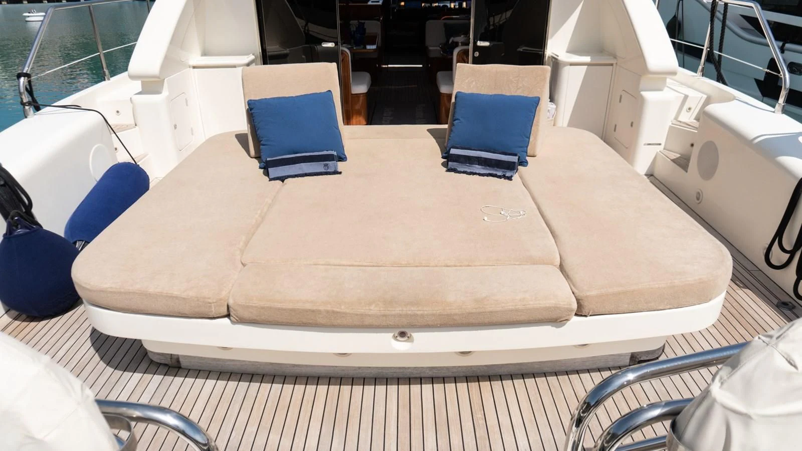 a wood table with chairs aboard BRAVO DELTA Yacht for Sale