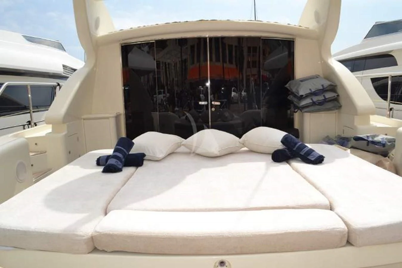 a bed with white sheets aboard BRAVO DELTA Yacht for Sale
