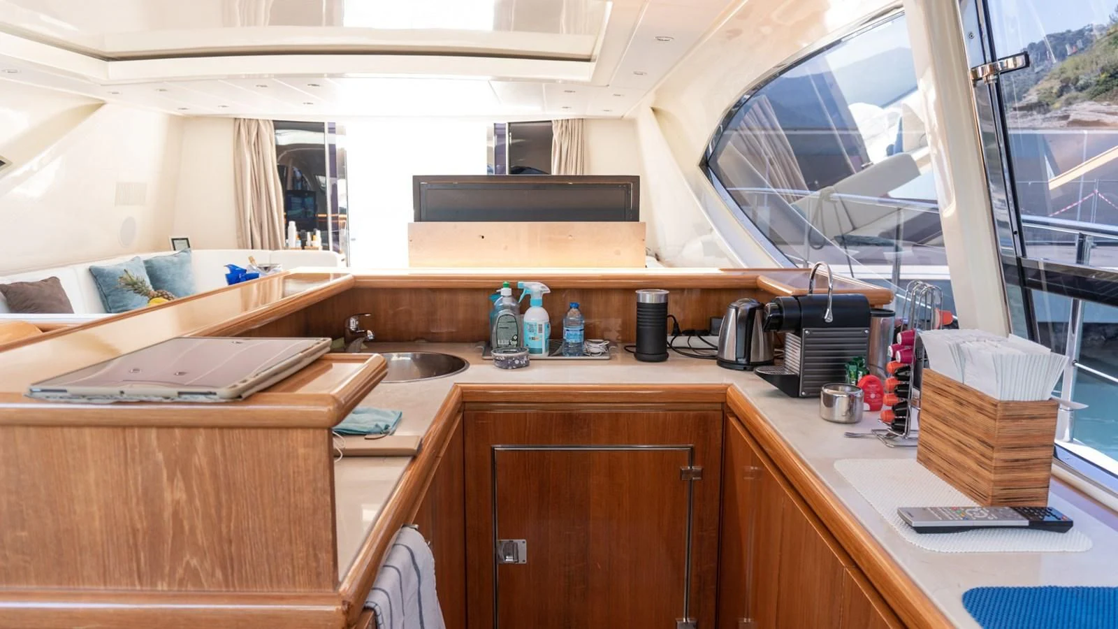 a kitchen with a sink and a window aboard BRAVO DELTA Yacht for Sale