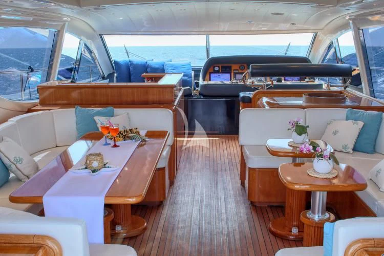 a boat with a table and chairs aboard BRAVO DELTA Yacht for Sale
