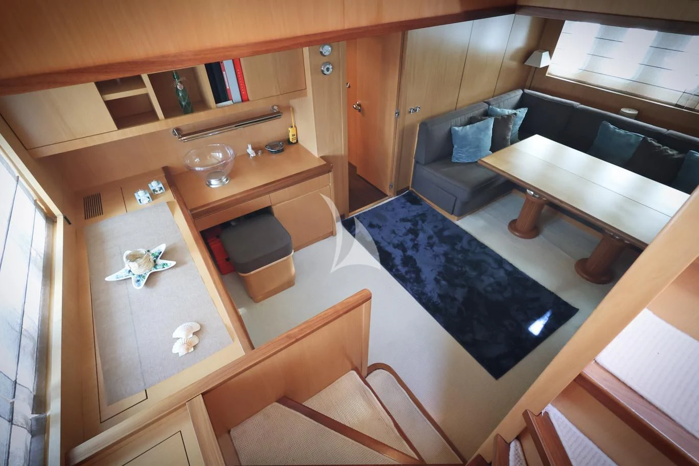 a room with a bed and a couch aboard BRAVO DELTA Yacht for Sale