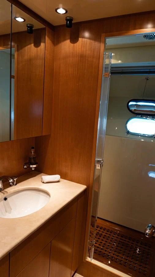 a bathroom with a sink and a shower aboard BRAVO DELTA Yacht for Sale