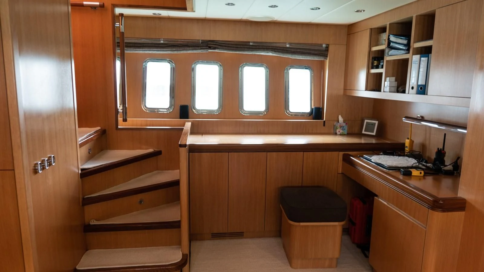 a wooden cabinet with a shelf and a trash can aboard BRAVO DELTA Yacht for Sale