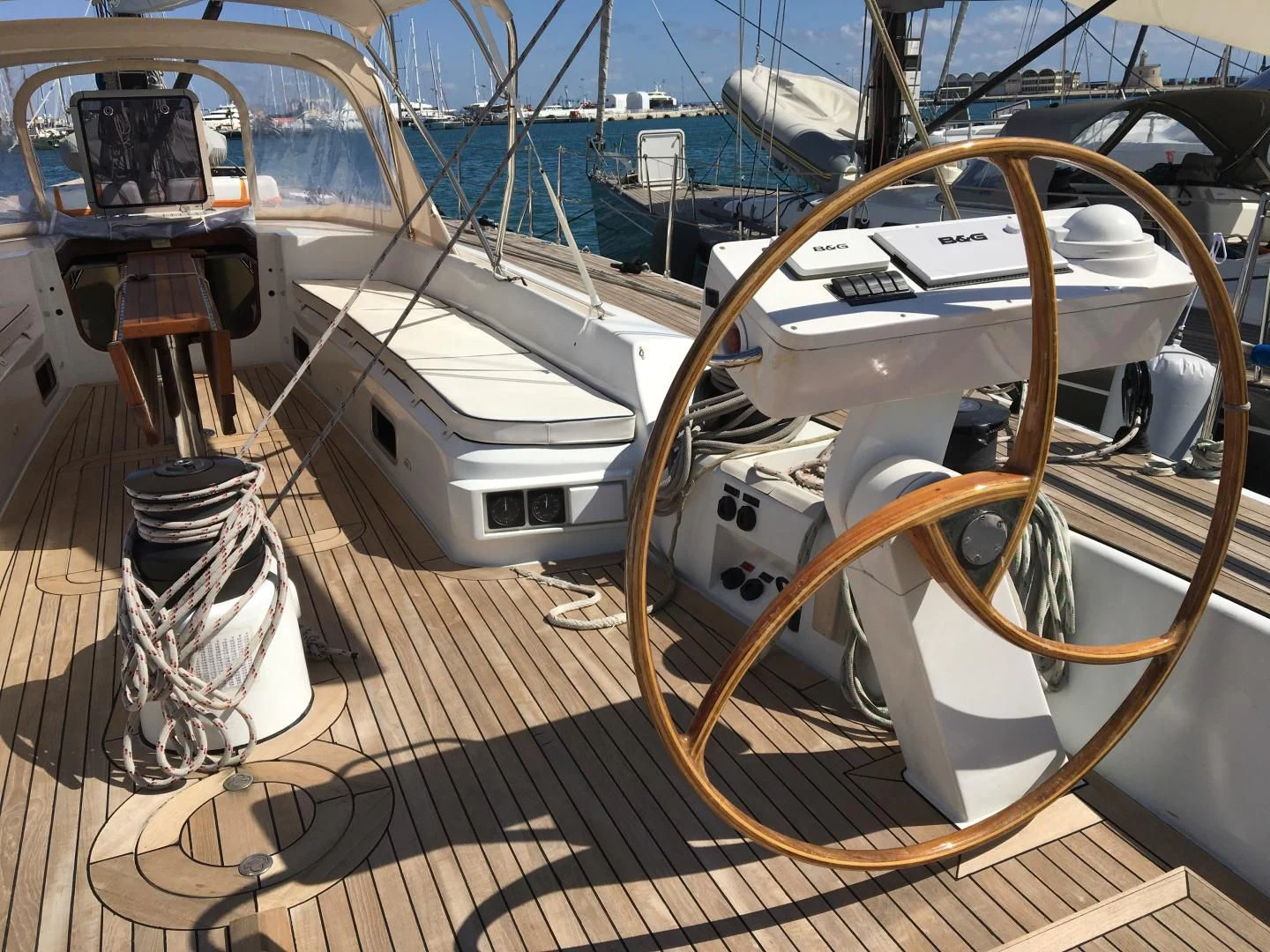 a large white boat on a dock aboard INDIGO Yacht for Sale