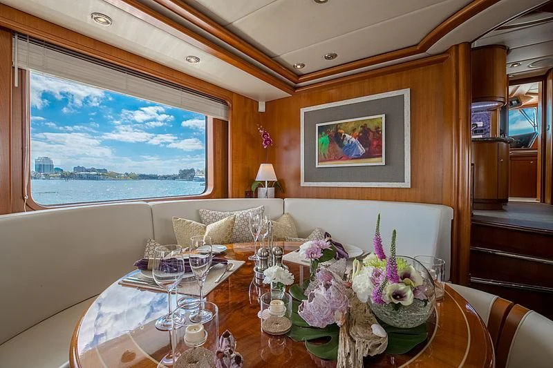 a dining room with a table and chairs aboard INDIGO Yacht for Sale