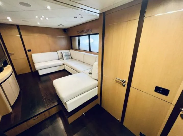a room with a couch and a door aboard GIGAONE Yacht for Sale