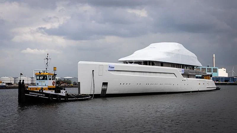 a boat next to a large boat aboard ZEN Yacht for Charter