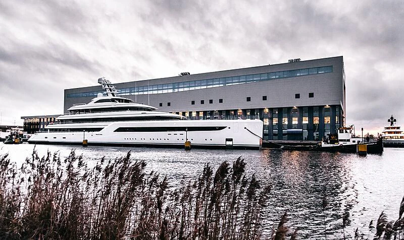 a large building with a large cruise ship in the water aboard ZEN Yacht for Charter
