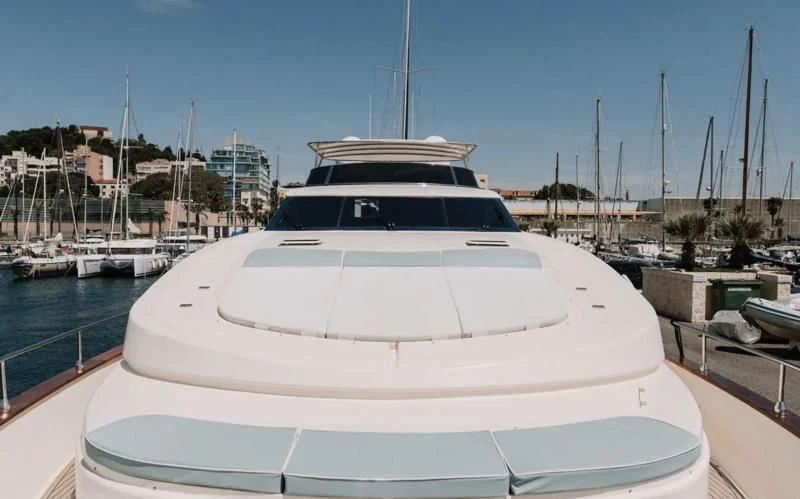 a white yacht in a marina aboard APOLLO I Yacht for Sale