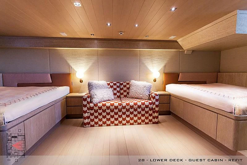 a room with a bed and a couple of beds aboard A2 Yacht for Sale