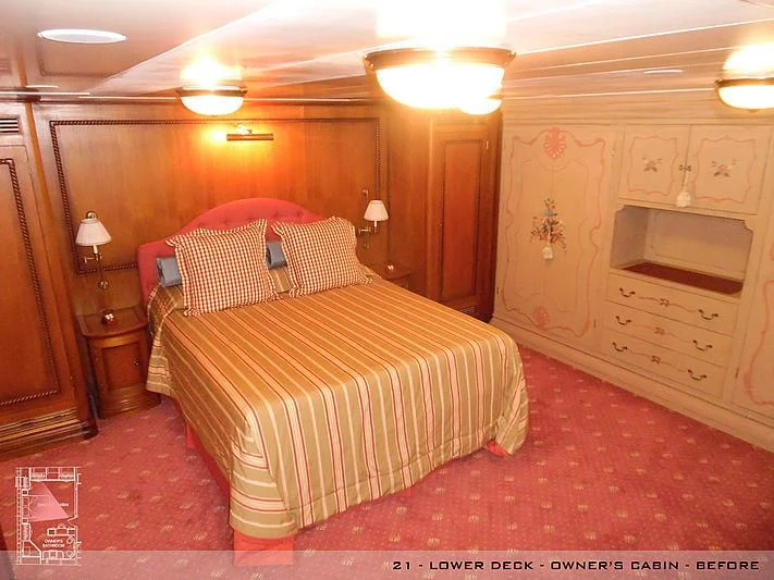 a bedroom with a bed and a dresser aboard A2 Yacht for Sale