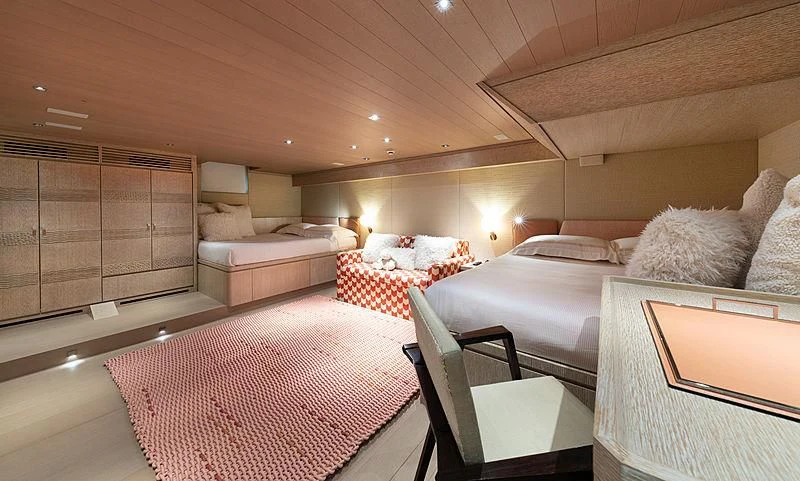 a room with a bed and a table aboard A2 Yacht for Sale