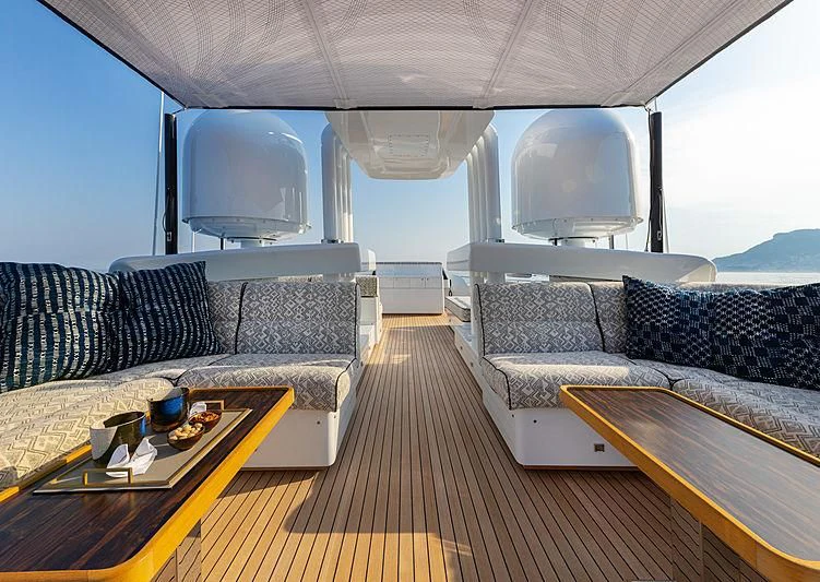 a living room with couches and a table aboard A2 Yacht for Sale