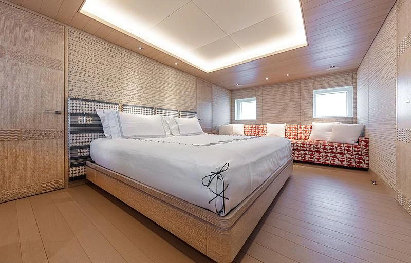 a room with a bed and a couch aboard A2 Yacht for Sale
