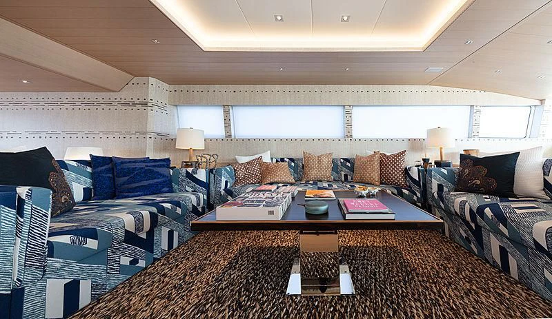 a living room with a couch and a coffee table aboard A2 Yacht for Sale