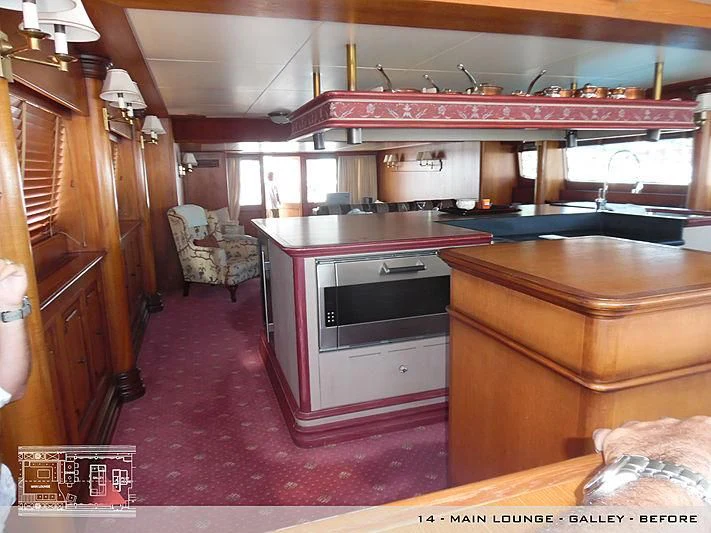 a kitchen with a red rug aboard A2 Yacht for Sale